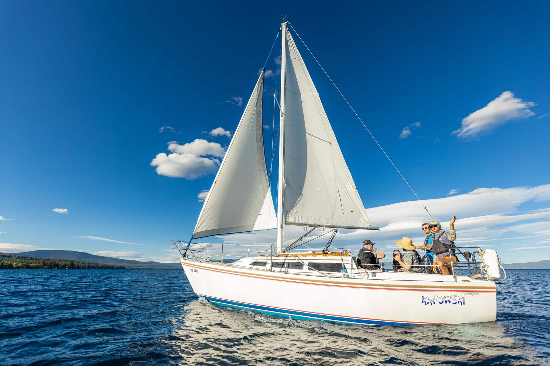 sailboat on lake tahoe|An 8D, GC3 and 10012 Battle Born Battery on a Boat|Woody from Mothership Adrift Holding a Wakespeed WS500 While Standing on His Sailboat Anchored at Sea|Cruisers Academy - Lake Tahoe