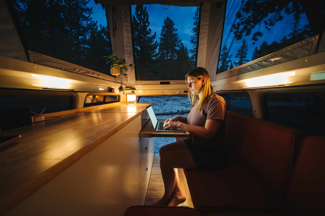 Typing on a Computer in a Pup-Up Camper Off Grid|Starlink Powered By Battle Born Batteries Diagram|Starlink Satellite in Snow-Covered Field Surrounded by Mountains