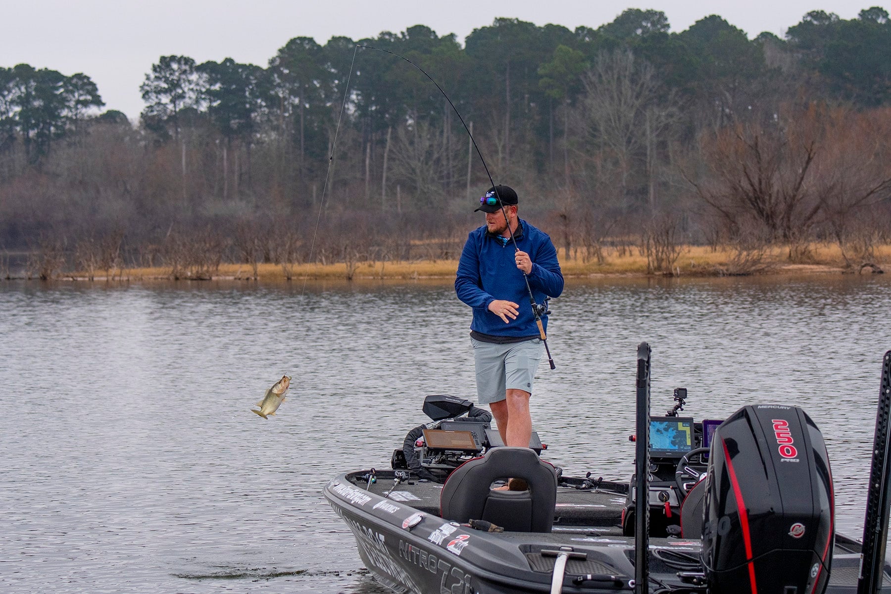 Angler catching a fish|angler casting a line|trolling motor powered by Battle Born Batteries|trolling motor powered by Battle Born Batteries|Angler using a trolling motor at sunset