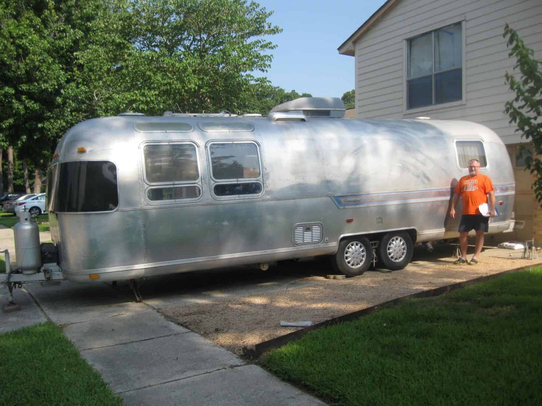 Karl D 1|Karl D 3|Karl-D-2-576×1024|Karl De Jong next to his 1979 Airstream Sovereign|De Jong takes a photo of all the parts that make up his set up.