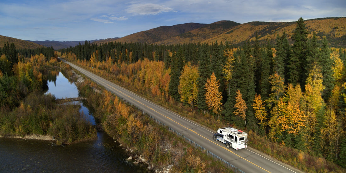 boondocking in alaska|Kendall Strachan and her Airstream in Alaska|Kendall Strachan and her Airstream in Alaska|RVing to Alaska RV by the Welcome to Alaska Sign|Mortons on the Move Truck Camper in the Forest