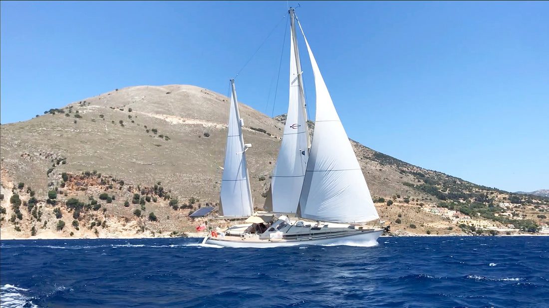 Mothership Adrift|Cruisers Academy - Lake Tahoe|Cruisers Academy - Lake Tahoe|Ben Owen's Sailboat Anchored in the Ocean|woman on sailboat mast|sailboat show