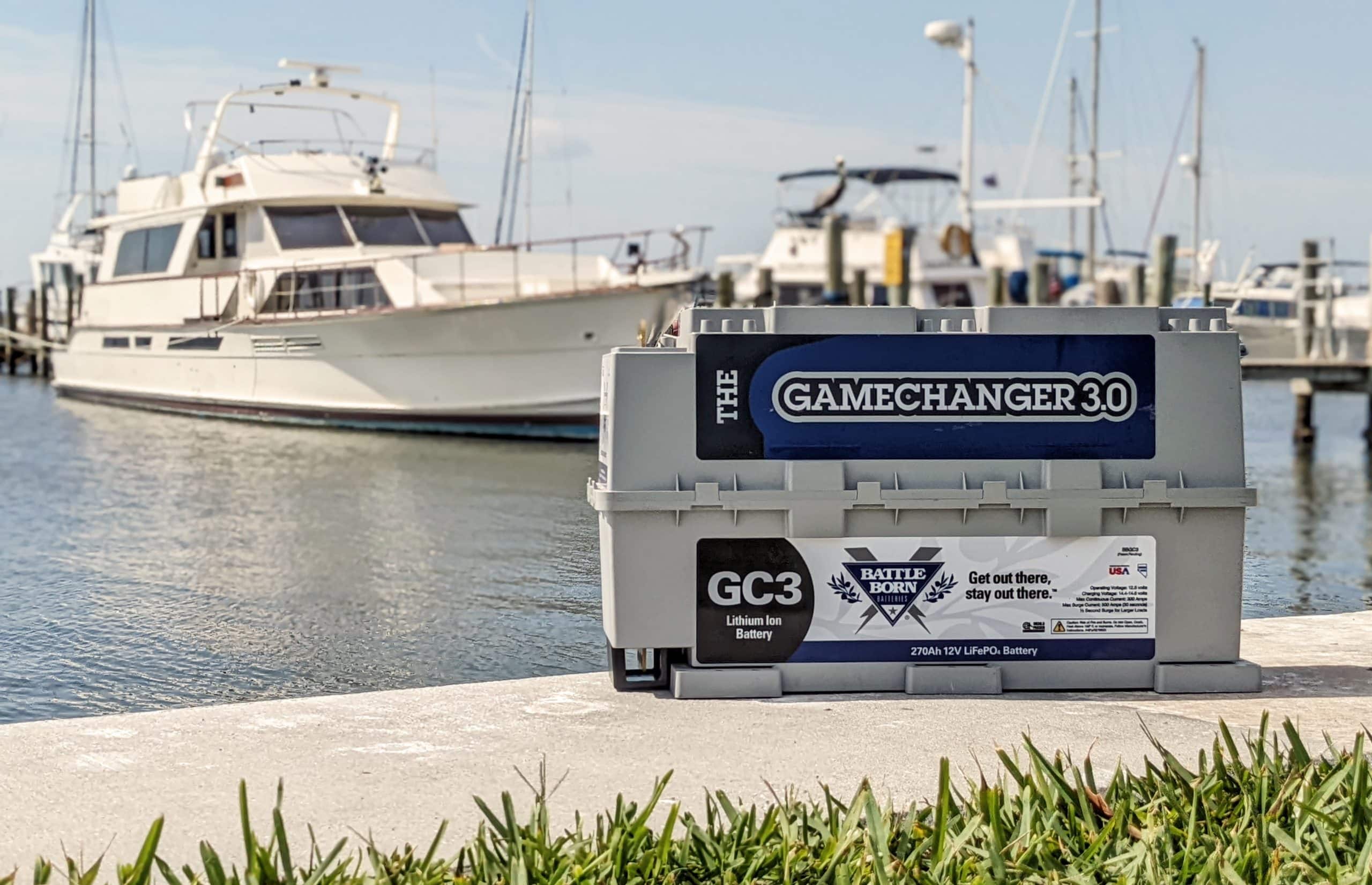 boat battery|Man Carrying a Battle Born Battery with a Strap Down a Dock|Docked Houseboats|boat battery voltage