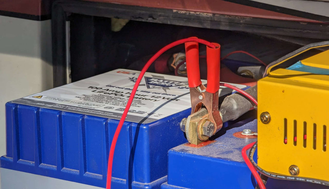 trickle charging battery|trickle charger on lithium battery|image-4|image-5|image-6|various types of 12v batteries|Lead acid battery attached to a trickle charger next to Battle Born Batteirs|BB_YouMeRV_R5-4101