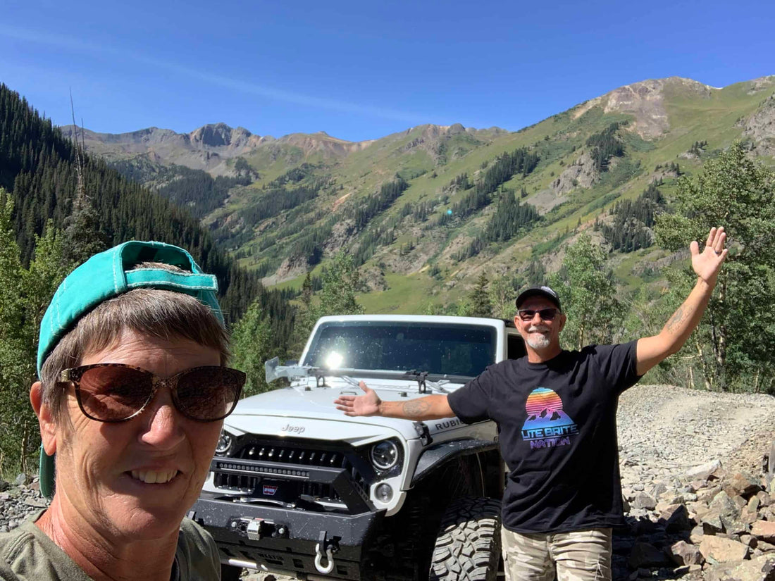 Lance and Flo Wende posing with their Jeep Rubicon in the mountains|Lance and Flo Wende|Wheelin' with the Wendes|Wheelin' with the Wendes|Battle Born Batteries|Wheelin' with the Wendes