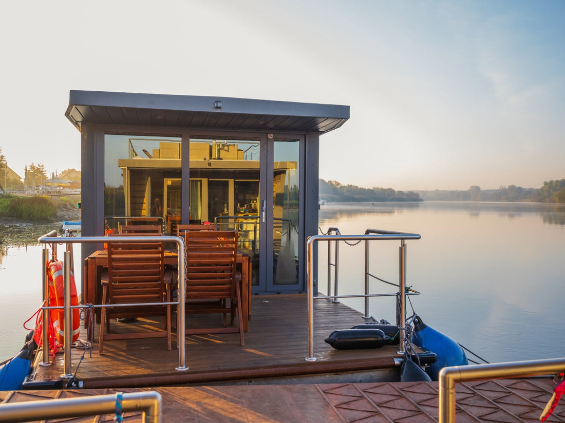houseboat on a river|Family gathered at table on houseboat sun deck|Houseboat cruising through the lake|Boy and girl jumping on bed in houseboat|Houseboat on the Water|Houseboats Docked|Houseboat on the Water at Sunset