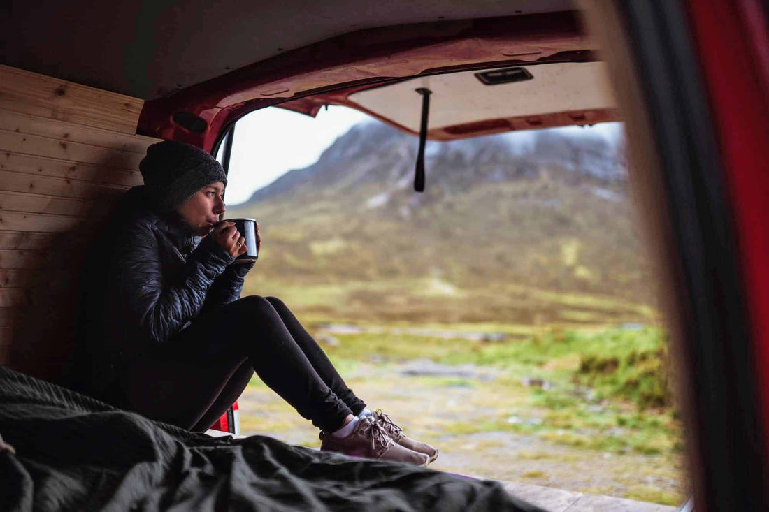 Woman in a camper sipping coffee|girl-in-a-warm-blanket-drinking-coffee-woman-relax-leisure-home-winter-cold-view-drink-cozy-casual_t20_4l8rYx|Frozen faucet in winter|tetons in winter