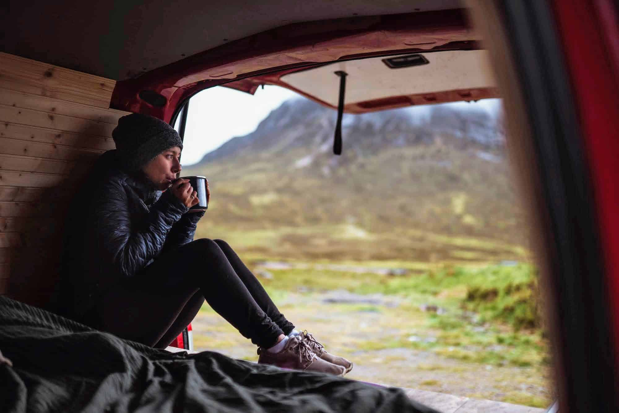 Woman in a camper sipping coffee|girl-in-a-warm-blanket-drinking-coffee-woman-relax-leisure-home-winter-cold-view-drink-cozy-casual_t20_4l8rYx|Frozen faucet in winter|tetons in winter