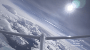 The tail of The Perlan Plane is pictured flying above clouds.