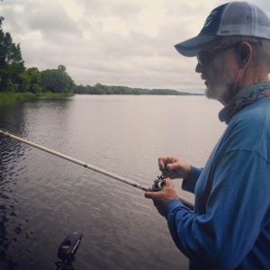 Rick Clunn holding a fishing rod