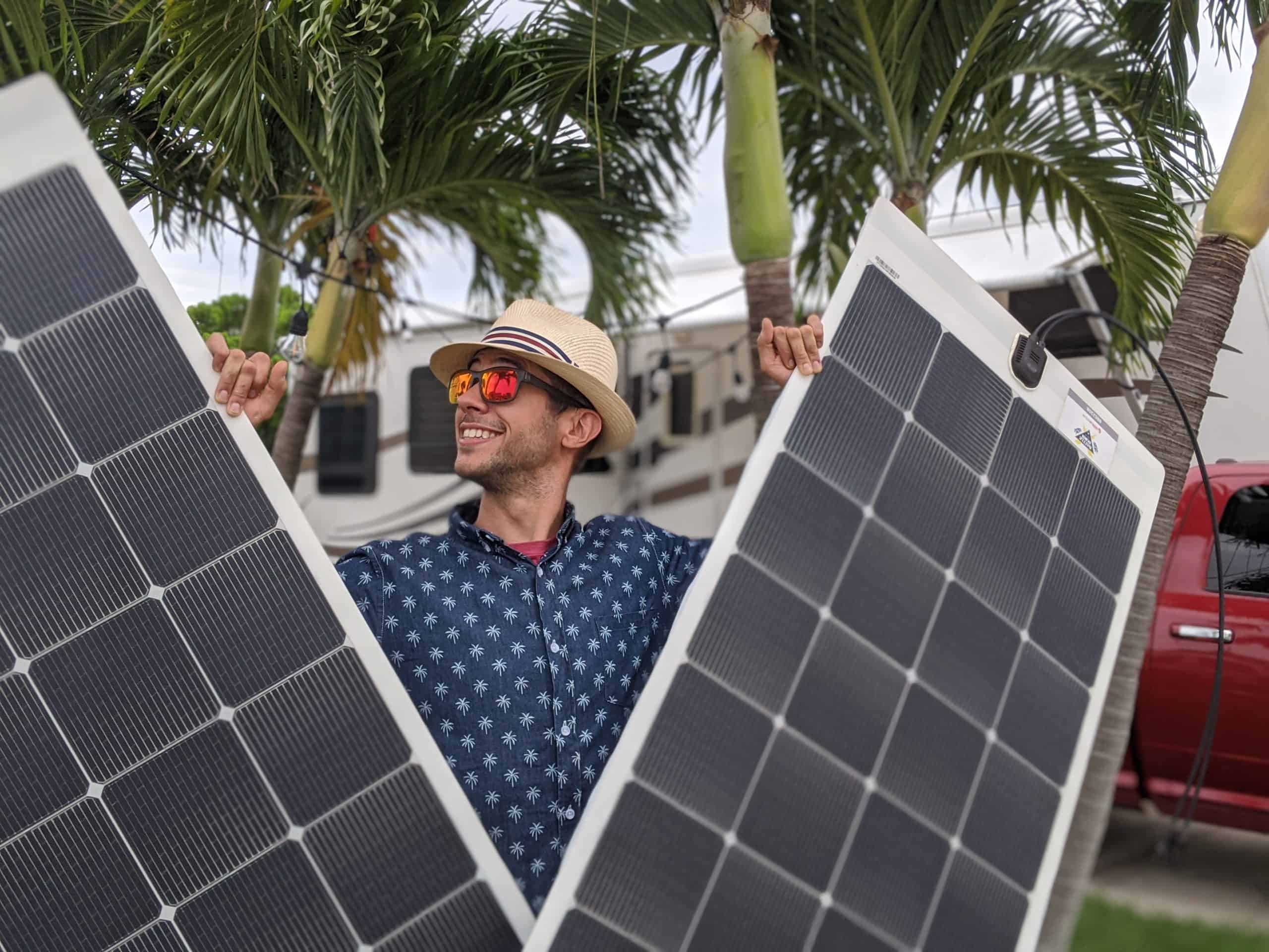 Tom Morton holding solar panels- Battle Born Batteries