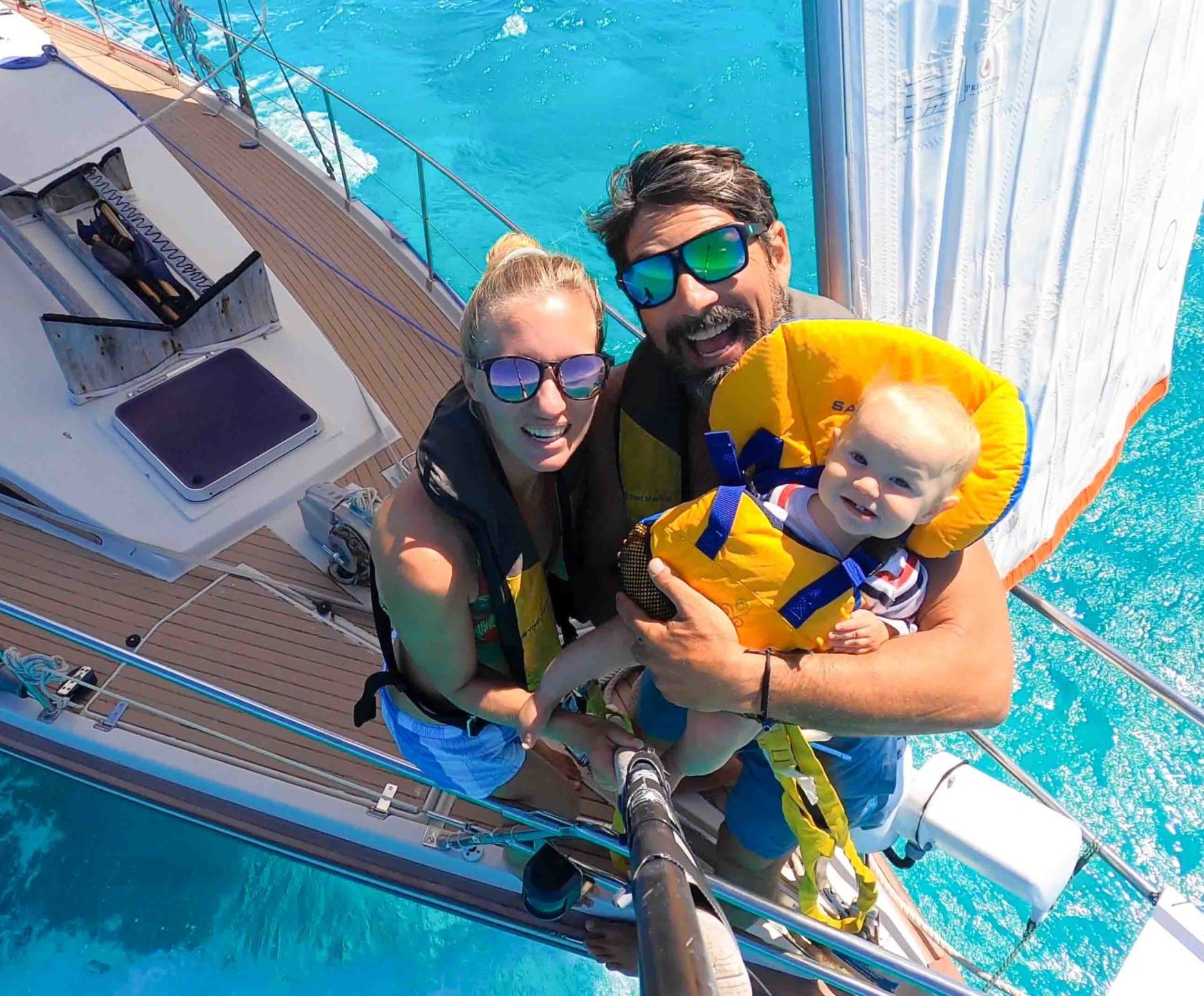 Brian, Karin and Sierra on the front of their sailboat