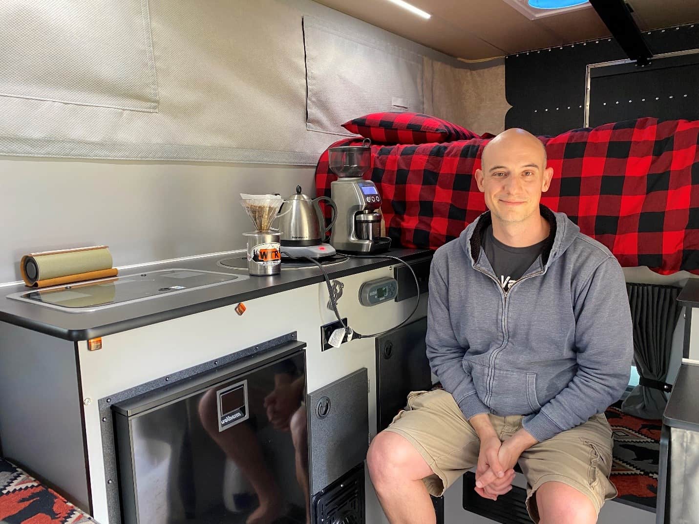 Joe Russo next to his induction stovetop