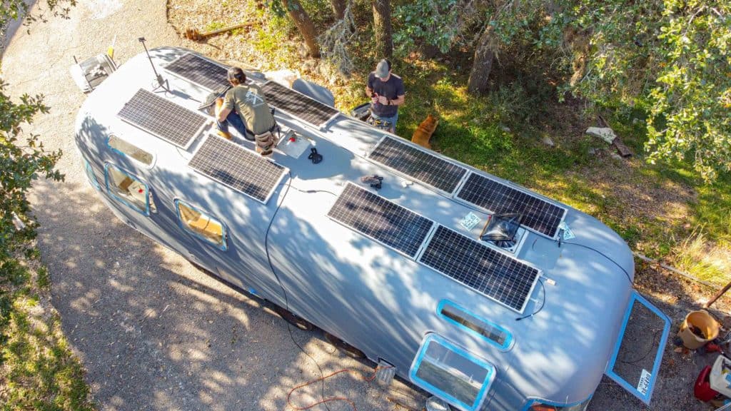 An aerial view of a trailer with solar panels.