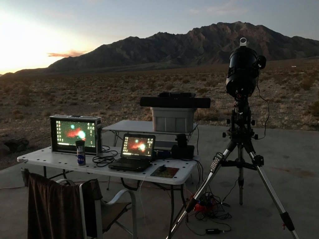 GeoAstro RV telescopes and computers set up at night. 