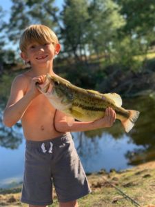 Young boy holding a bass