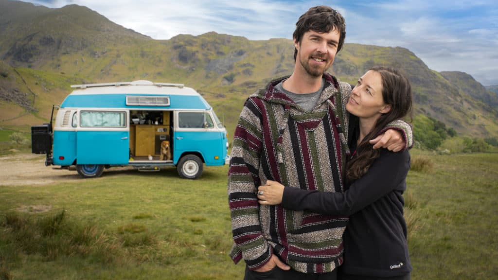 A photo of Ben and Leah outside their Kombi.