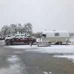 Zola the vintage camper stuck in the snow during a May 2019 snowstorm.