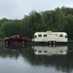 A 1976 28-foot Airstream Argosy vintage camper called Zack in the rain.