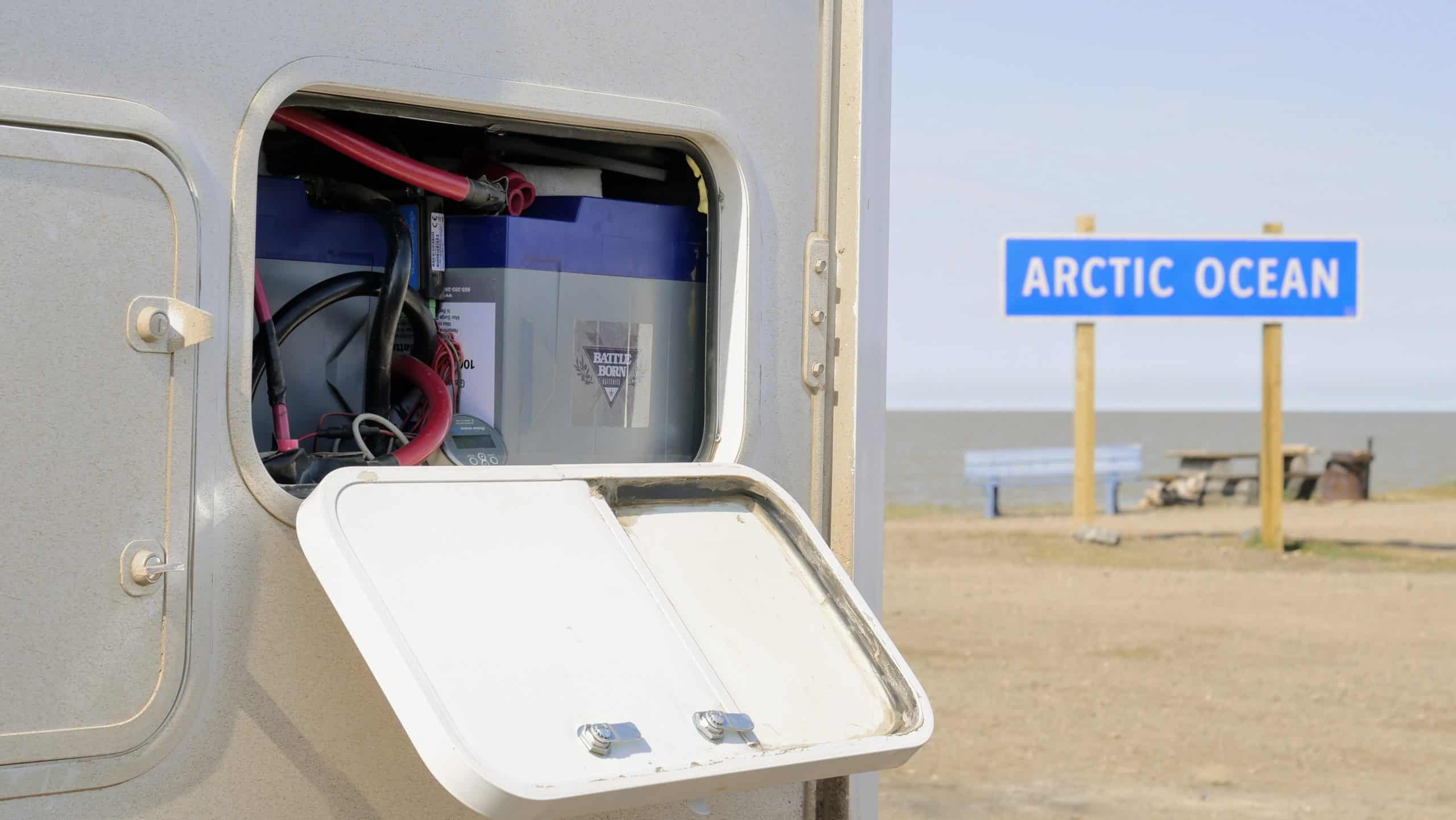 Battle Born Batteries in an RV compartment near the Arctic Ocean