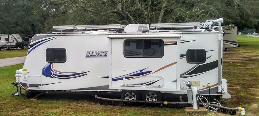 Lance RV hooked up to a power hookup