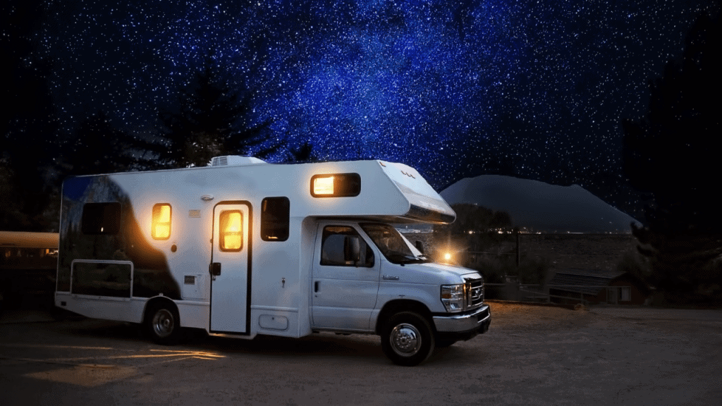 class c motorhome rv parked under the stars