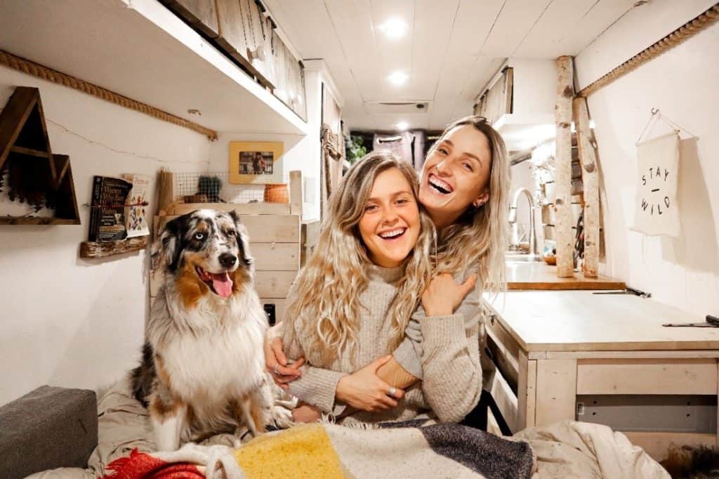 The Van Wives with their Australian Shepard inside of their rig