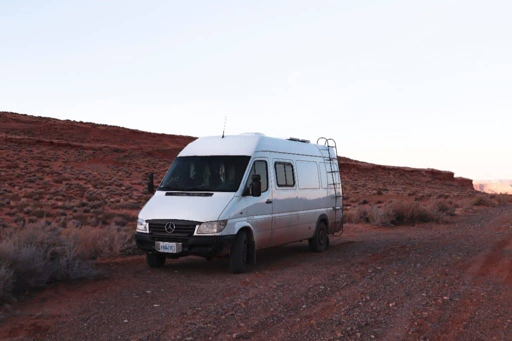 The Vanwives' Sprinter van parked in the desert