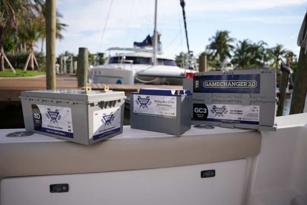 lithium batteries in various sizes on a boat at a marina