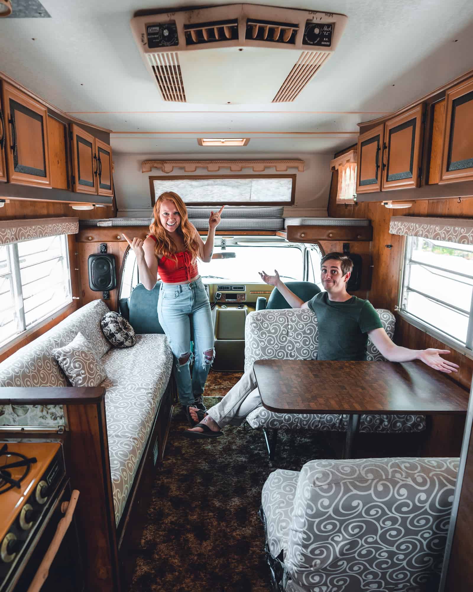 Interior of The Endless Adventure's Class C RV with the couple inside