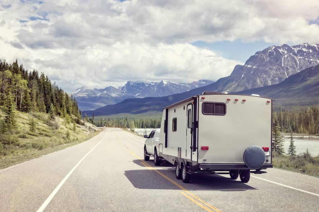 travel trailer rv on a mountain road in Canada
