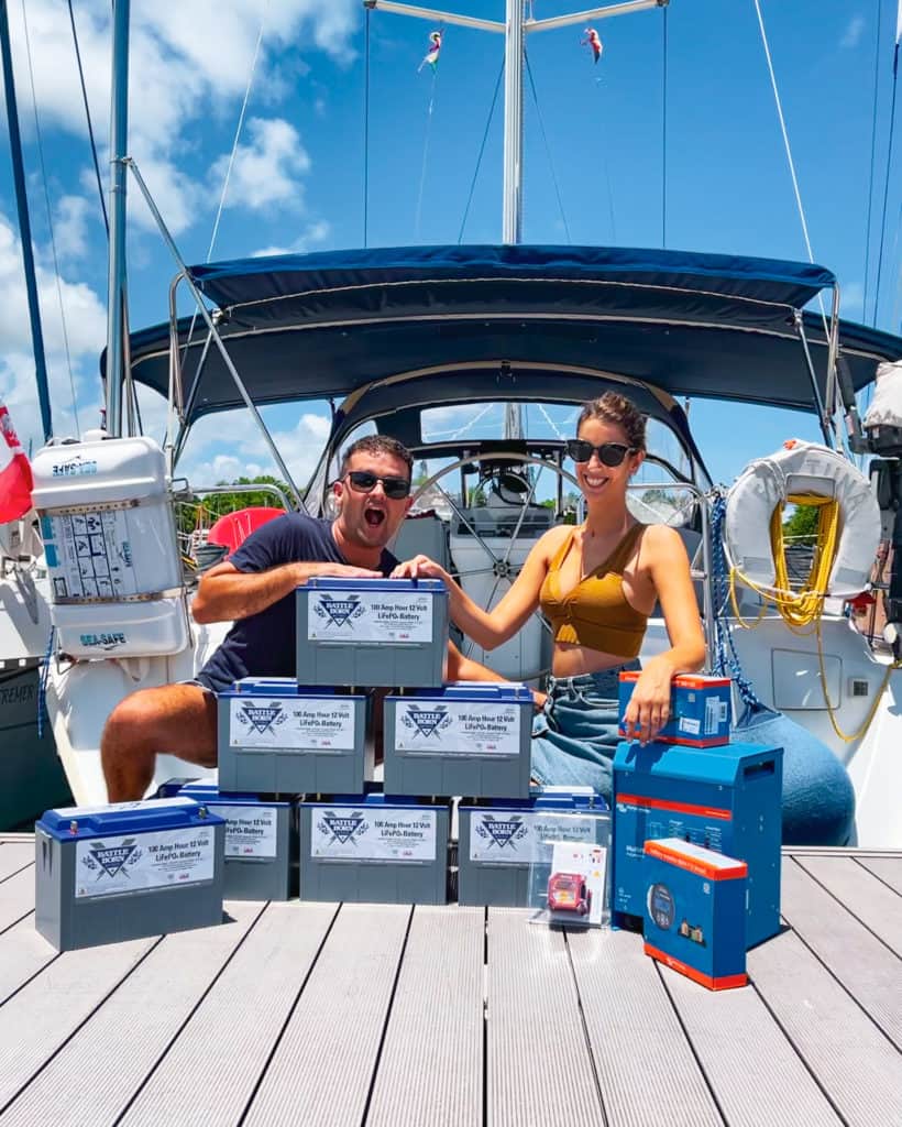 Michael and Greta posing with their Battle Born Batteries on their boat