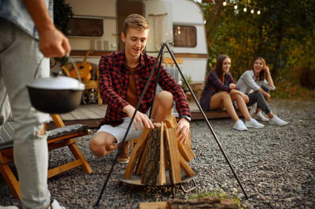 happy campers about to start a campfire