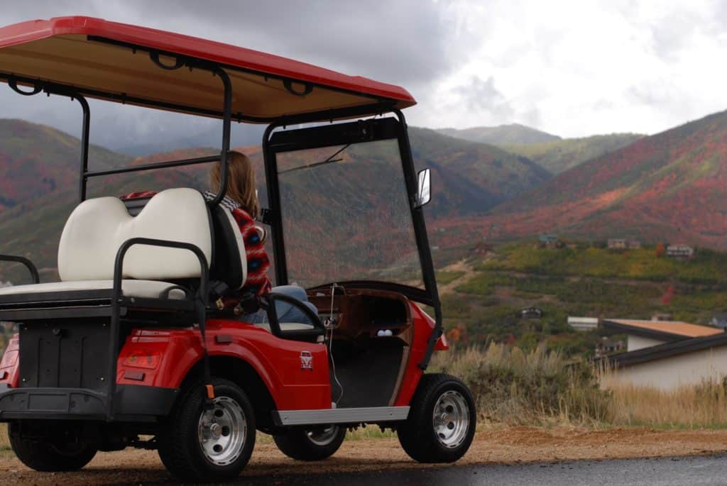 red golf cart in hills