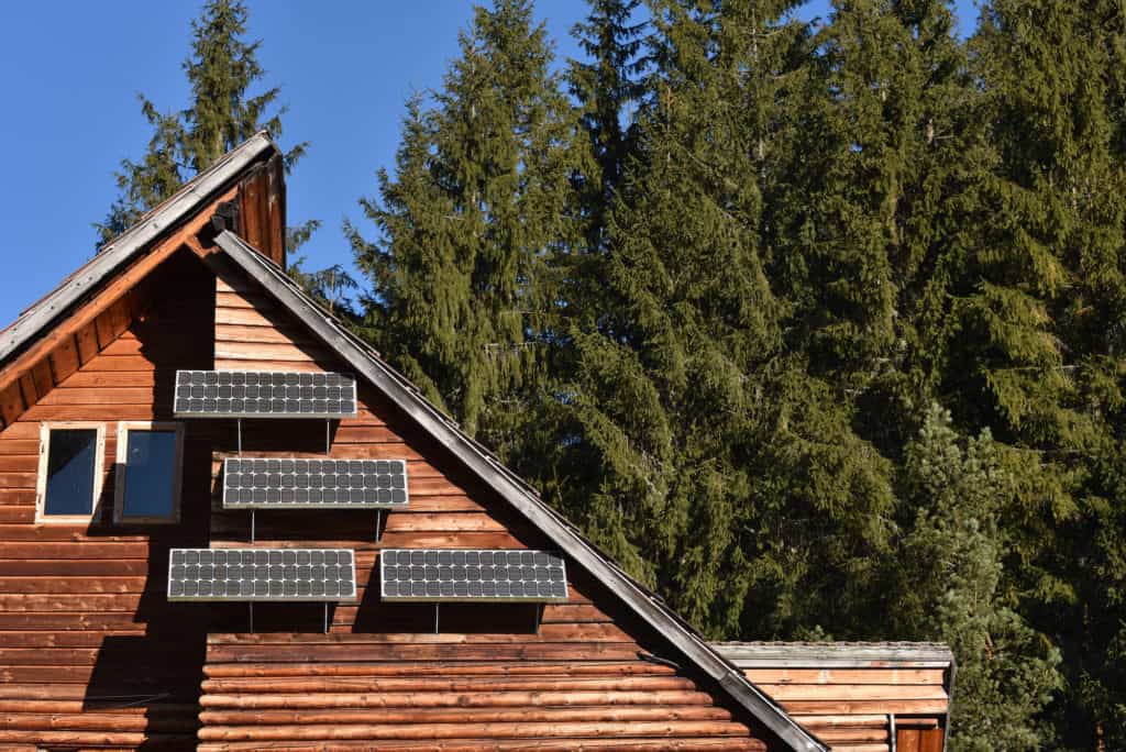 solar panels on side of cabin