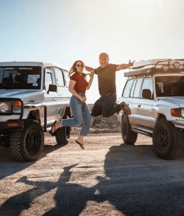 Linhbergh Nguyen and Karissa Hosek next to their respective land cruiser rigs