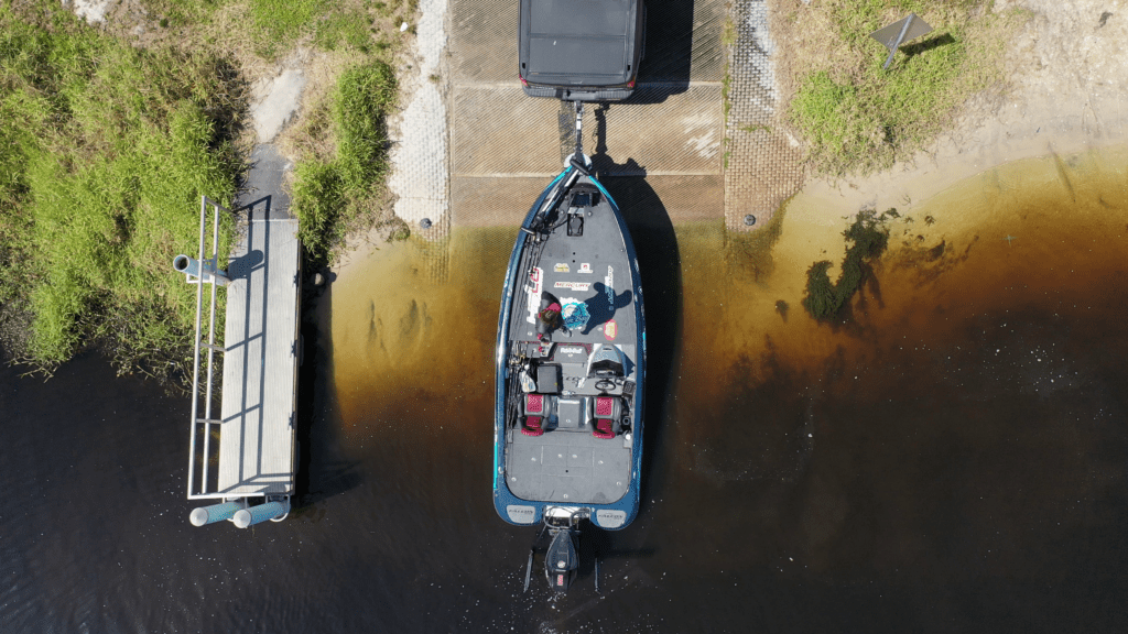 Aerial shot of a bass boat at a boat launch