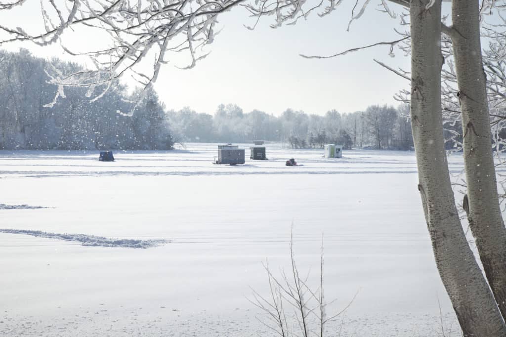 Picture of a frozen lake covered in snow