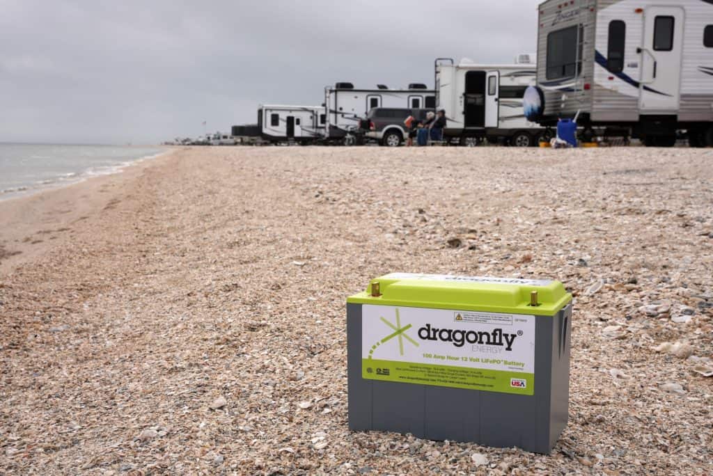 lithium battery on beach in texas with free camping in the background