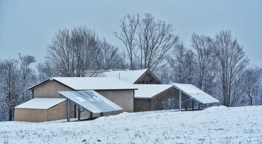 snow on residential solar panel system