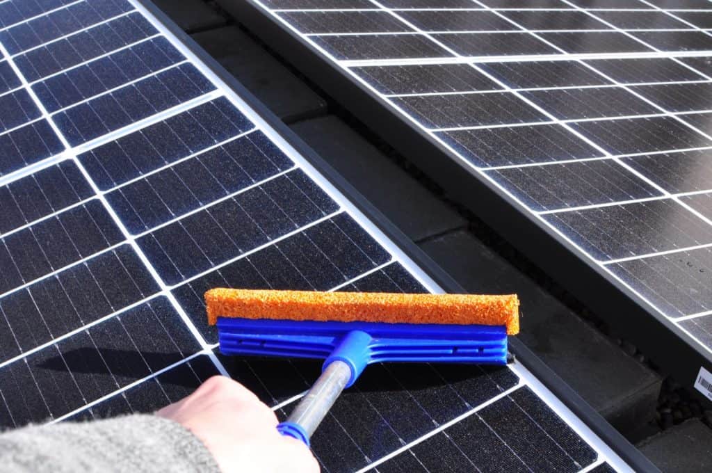 squeegee solar panels clean