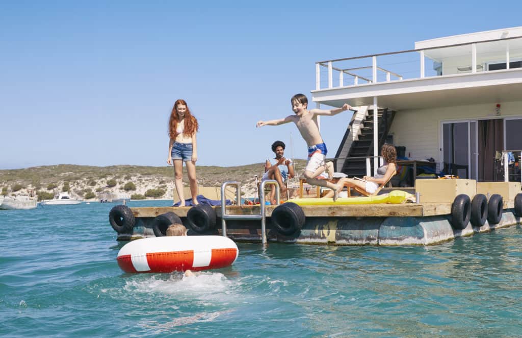 Family having fun on houseboat sun deck
