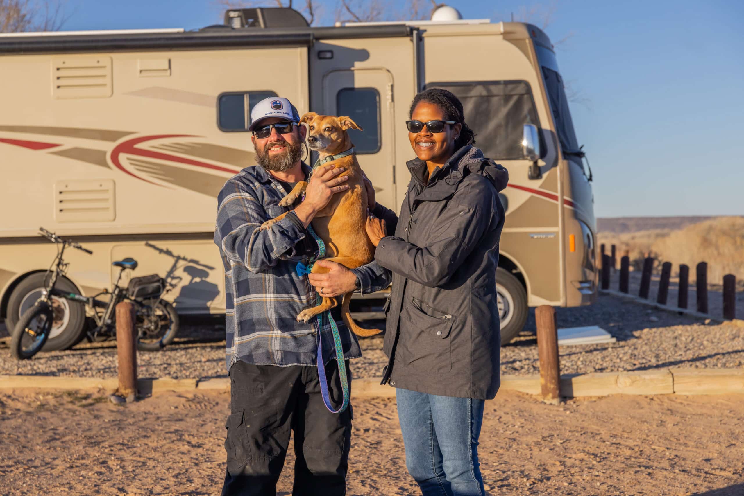 Moving Forward Adventures Family in Front of Their RV