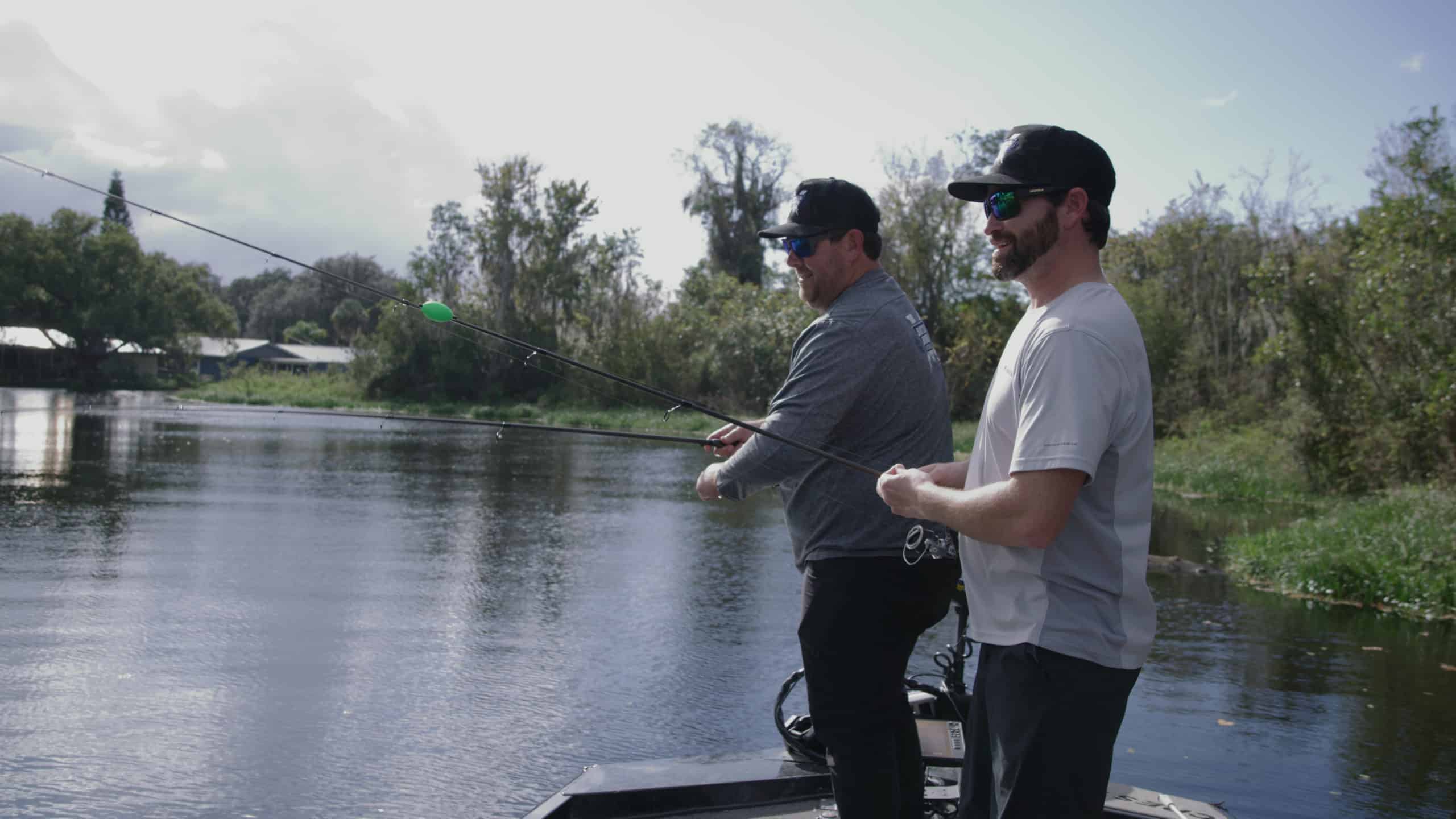 Keith Carson and John Cox fishing at a pond