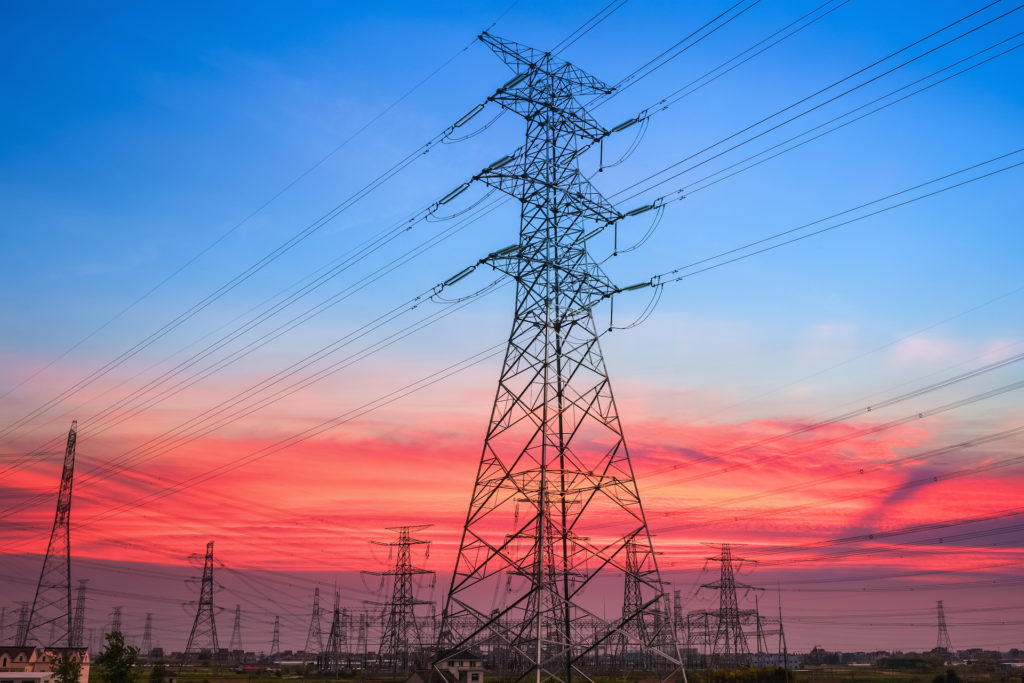 Powerlines with a sunset in the background