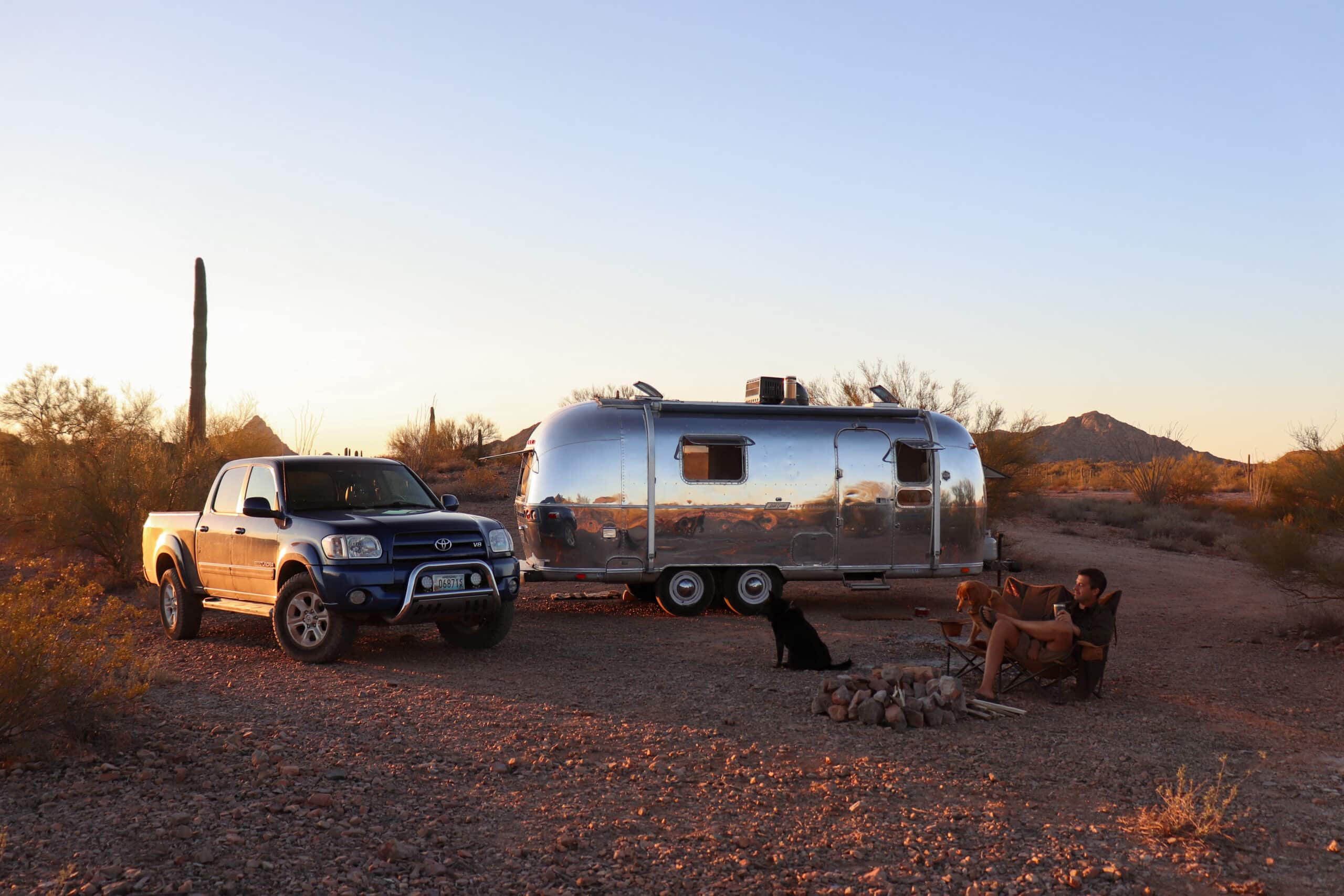 Tommy, Missy, and Trip in Front of Slow Car Fast Home's Airstream in the Arizona Desert