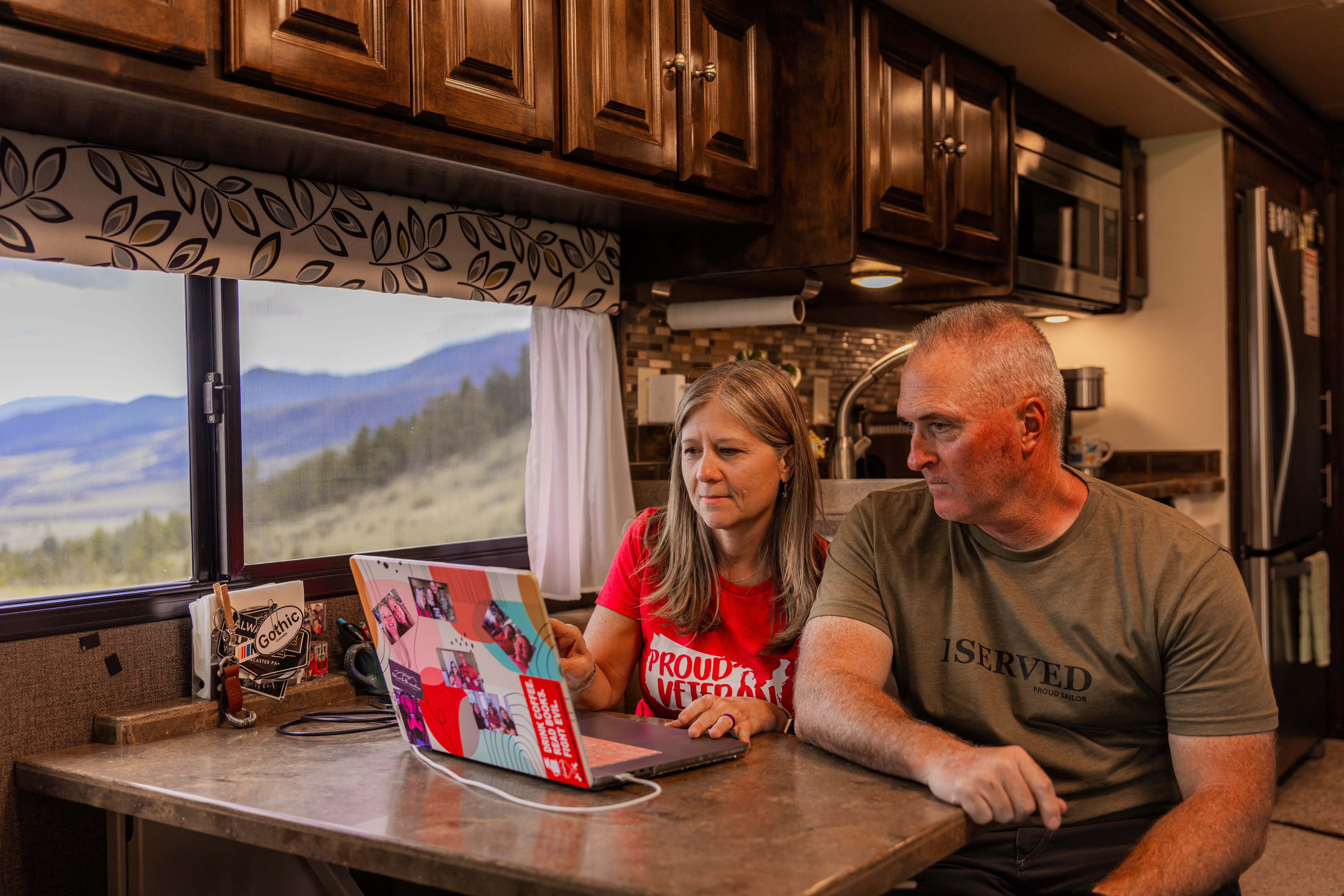 You, Me & The RV Working on a Laptop in Their RV