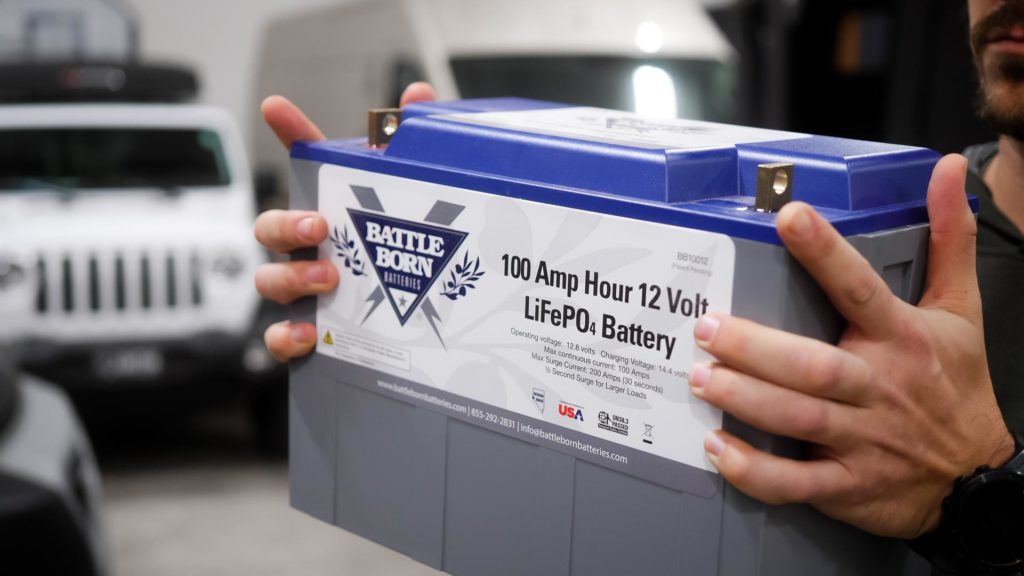 battle born lithium battery being lifted with overland jeep in background