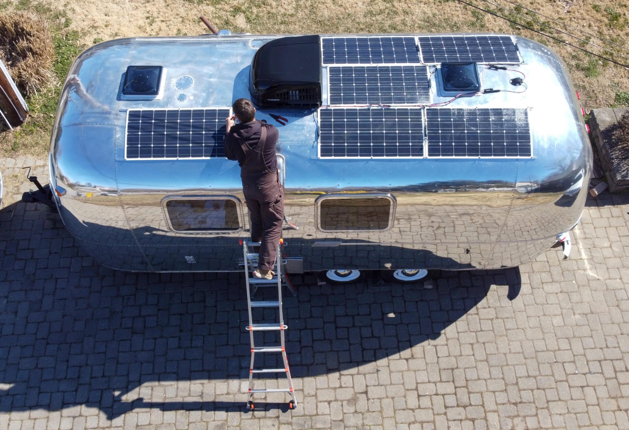 Tommy Installing Solar Panels on Slow Car Fast Home's Airstream