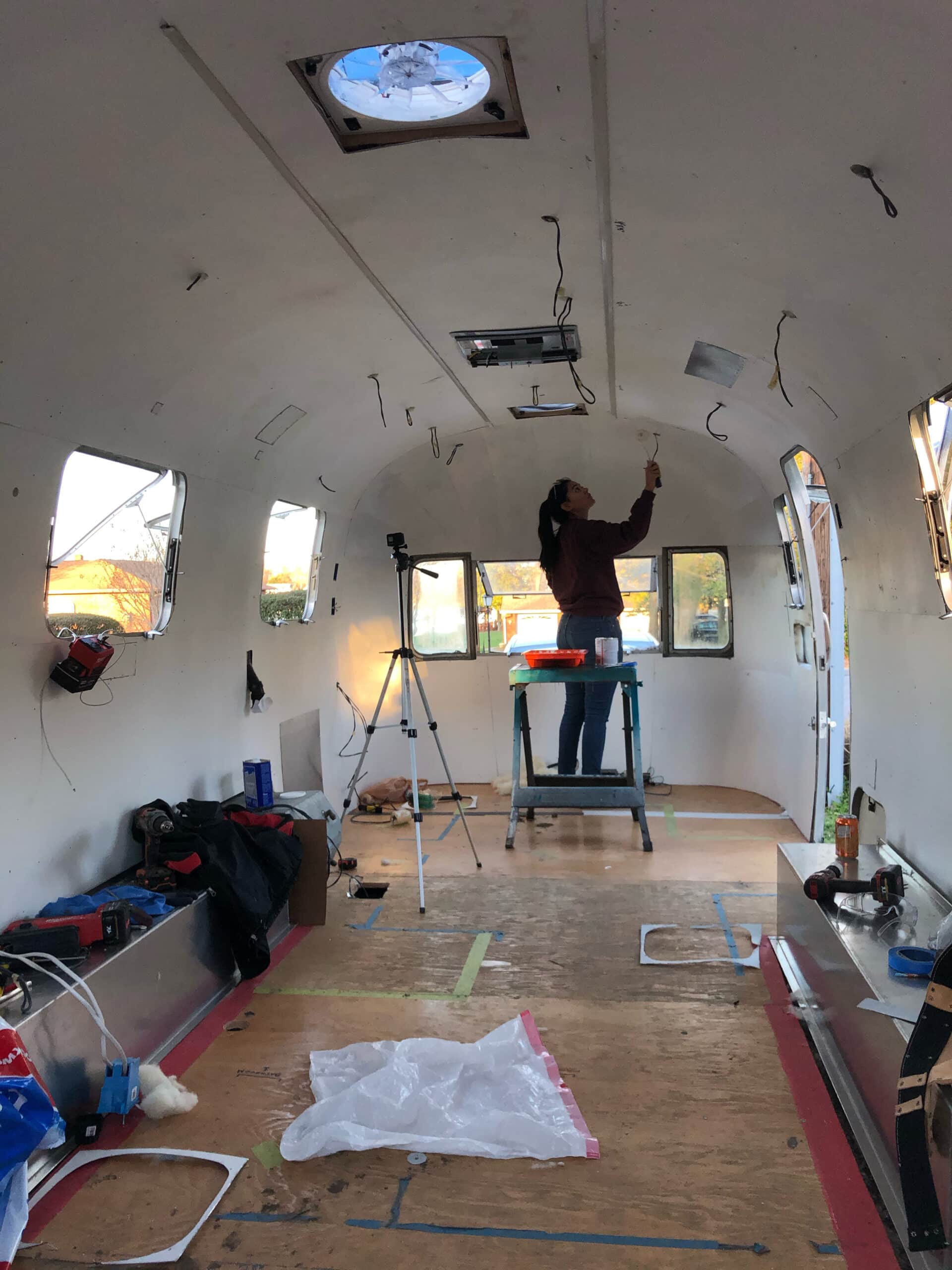 Danielle Painting the Interior Aluminum of Their Airstream While Renovating